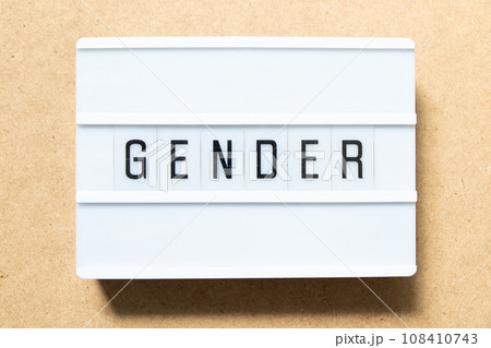 Lightbox with word gender on wood background 108410743
