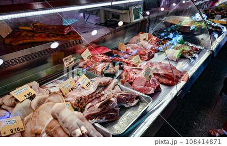 Paris, France. June 30 2022. At the beautiful local market Popincourt, a meat counter. Different varieties and cuts of meat on display. Paris, France. June 30 2022. At the beautiful local market Popincourt, a meat counter. Different varieties and cuts of meat on display. 108414871