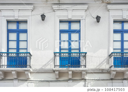 Street view of an old colonial building facade in Quito, Ecuador. Street view of an old colonial building facade in Quito, Ecuador. 108417503