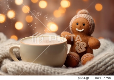 knitted gingerbread man near a cup of cappuccino on a Christmas background 108417790