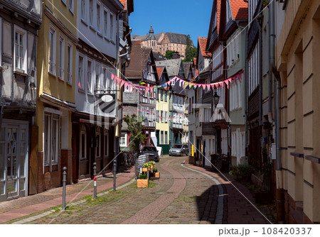 Marburg. An old medieval street in the historical center on a bright sunny day. 108420337
