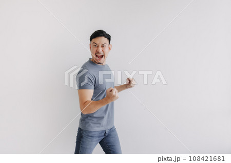 Happy asian man feels victory emotion stand isolated on white, Win and success Happy asian man feels victory emotion stand isolated on white, Win and success 108421681