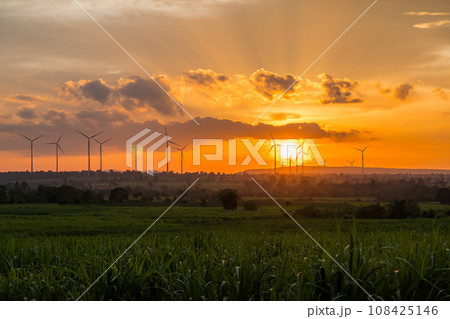 Landscape Windmill on a mountain with vast meadows at sunset, beautifully illuminated. 108425146