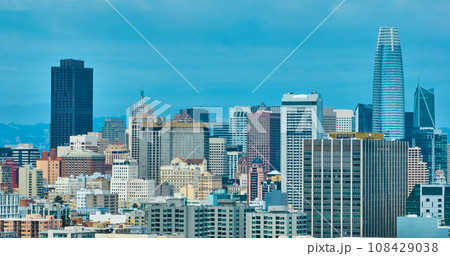 Aerial wall of San Francisco skyscraper buildings under hazy blue sky Aerial wall of San Francisco skyscraper buildings under hazy blue sky 108429038