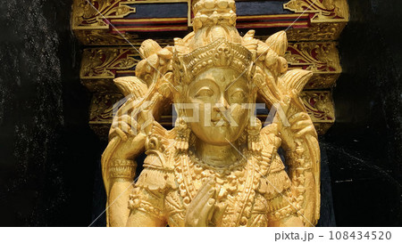 Balinese Hindu God golden Shiva Durga statue on a sacred Hindu temple in Indonesia 108434520