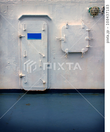 The exits Door of a Caribbean cruise ship and window in the blue sea. Abstract of banners concept. The exits Door of a Caribbean cruise ship and window in the blue sea. Abstract of banners concept. 108437183