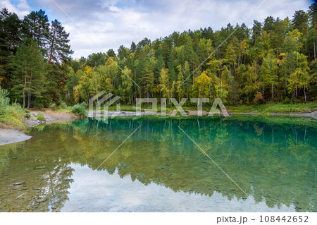 Scenic view of autumn trees reflecting in calm blue lake at Altai, Russia 108442652