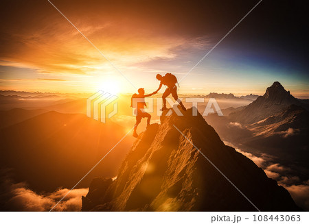 Help and assistance concept. Hiker helping friend reach mountain top, thanks to mutual assistance and teamwork. Hiker helping friend reach mountain top 108443063