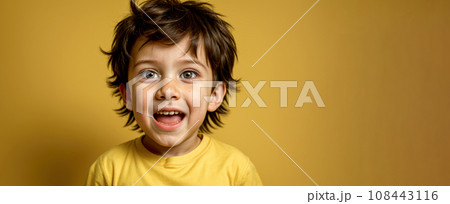 Portrait of surprised little boy isolated on yellow background. boy is surprised. portrait of a beautiful little boy Portrait of surprised little boy isolated on yellow background. boy is surprised. portrait of a beautiful little boy 108443116