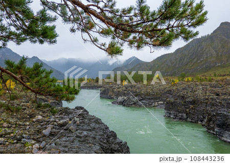 Scenic view of Katun river flowing amidst rocky coastlines with mountains in background at Altai, Russia 108443236