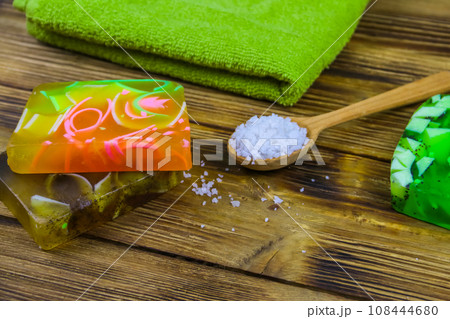 Set of handmade soap bars, sea salt and towel on wooden background. SPA concept 108444680