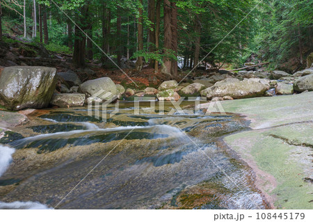 Mountain river Mumlava, Krkonose national park, Czech Republic, summer afternoon. River flow above the waterfall Mountain river Mumlava, Krkonose national park, Czech Republic, summer afternoon. River flow above the waterfall 108445179