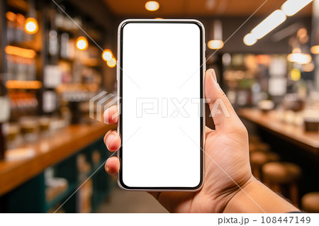 Mockup of Smartphone with White Screen in Male Hands in Cozy Coffee Shop or Boutique App Advertising 108447149
