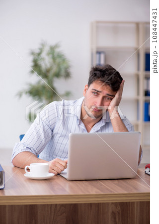 Young male employee working in the office 108447431