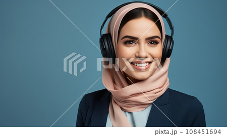 Arabian business model in businesslike suit isolated on blue background, with space to side for writing Arabian business model in businesslike suit isolated on blue background, with space to side for writing 108451694