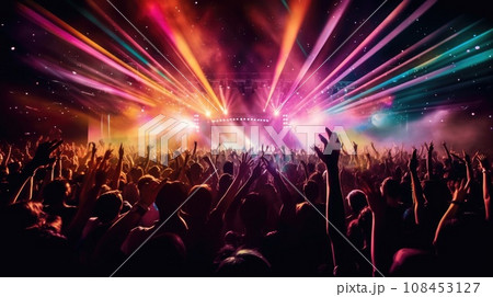 silhouette of concert crowd in front of bright stage lights 108453127