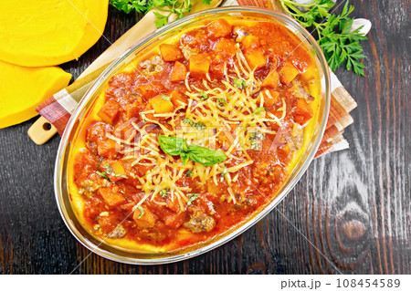 Porridge corn with meat and vegetables in roaster on board top 108454589