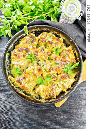 Rolls of zucchini with meat in pan on board top 108454763