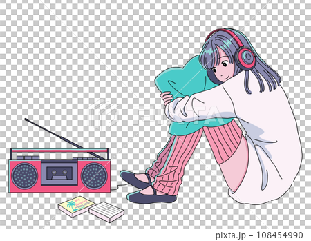 A girl listening to music from a cassette tape on a radio cassette player 108454990