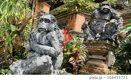 Stone monkeys statues in sacred monkey forest. Old decorative monkey sculptures in Bali ubud sacred forest Stone monkeys statues in sacred monkey forest. Old decorative monkey sculptures in Bali ubud sacred forest 108455721