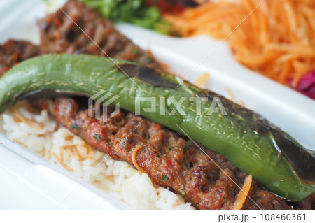 Kebab, traditional turkish meat food with salad on a plate . 108460361