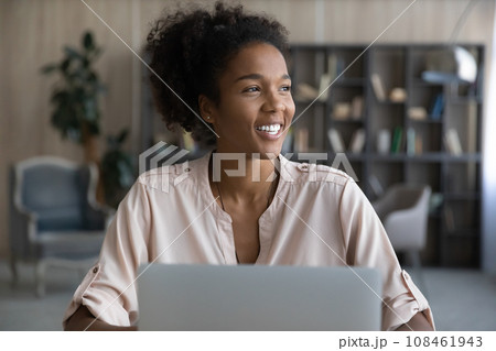 Happy Afro American student girl using laptop, studying from home 108461943