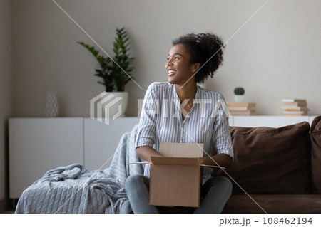 Happy young African woman, millennial shopper, online store customer 108462194