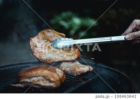 barbecue camping with grill pork neck at night 108463642