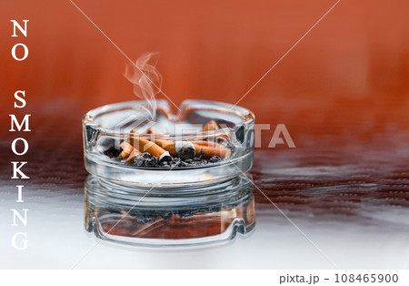 Do not smoke sign. No Smoking label in the public. The ashtray is used in the cafe. Do not smoke sign. No Smoking label in the public. The ashtray is used in the cafe. 108465900