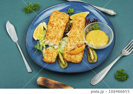 Fried pollock fillets with breadcrumbs Fried pollock fillets with breadcrumbs 108466655