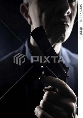 Assasin spy killer with handgun pistol Assasin spy killer with handgun pistol 108468005