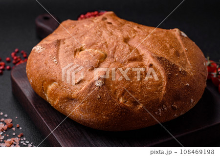 Delicious fresh crispy brown bread with seeds and grains 108469198