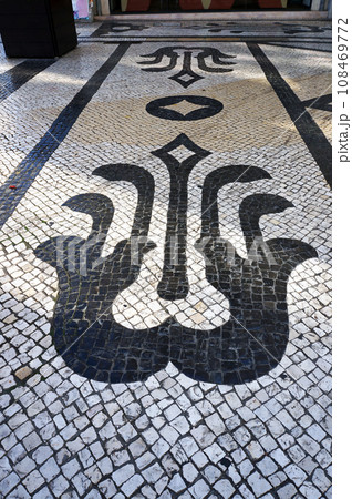 One of Patterns of Traditional Mosaic Paving Tiles on Streets of Lisbon, Portugal. One of Patterns of Traditional Mosaic Paving Tiles on Streets of Lisbon, Portugal. 108469772