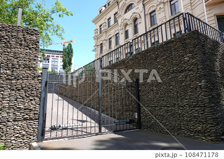 Kiev, Ukraine June 10, 2021: the old forged gate, which closes the passage to the courtyard of the house 108471178