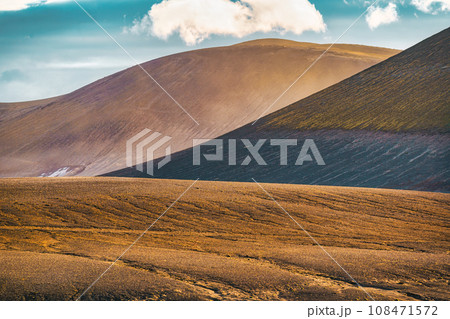 Volcanic mountain stacked and blue sky on wilderness in summer Volcanic mountain stacked and blue sky on wilderness in summer 108471572
