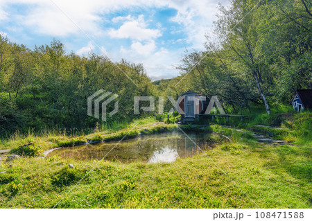 Hot spring pool with wooden hut in the forest Hot spring pool with wooden hut in the forest 108471588