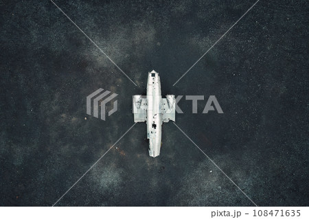 Crashed military DC 3 plane wreck on black sand beach in Iceland 108471635
