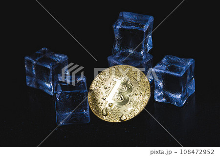 Ice and bitcoin coin. Freezing of cryptocurrency accounts. Frozen bitcoin coin. 108472952