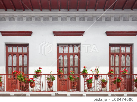 Street view of an old colonial building facade in Quito, Ecuador. 108474680