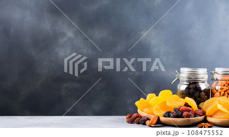 Assorted dried fruits in glass container. 108475552