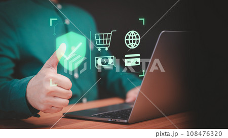 Customer use a computer laptop with sign of security protection system on virtual screen. Guarantee, Standard, Certified guarantee approval or secure access internet. Shopping on online application. Customer use a computer laptop with sign of security protection system on virtual screen. Guarantee, Standard, Certified guarantee approval or secure access internet. Shopping on online application. 108476320