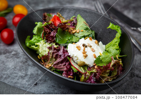 salad with spinach, eel, lime, sour cream, side view salad with spinach, eel, lime, sour cream, side view 108477084