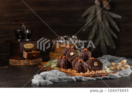 Dark chocolate truffles with hazelnuts Dark chocolate truffles with hazelnuts 108478845