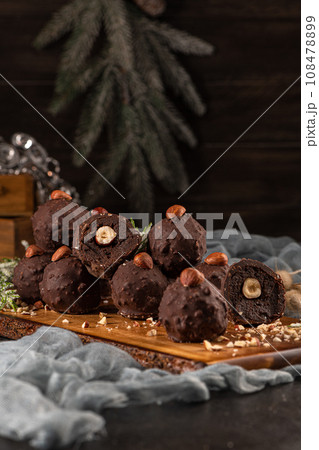 Dark chocolate truffles with hazelnuts Dark chocolate truffles with hazelnuts 108478899