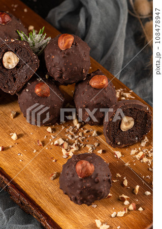 Dark chocolate truffles with hazelnuts Dark chocolate truffles with hazelnuts 108478947