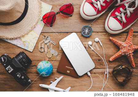 Travel accessories costumes. The cost of travel maps prepared for the trip.travel planning concept Travel accessories costumes. The cost of travel maps prepared for the trip.travel planning concept 108481948