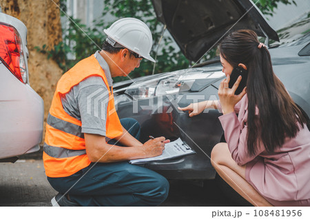 male insurance officer came to help inspect a customer's car that had an accident. Concept for vehicle crash, insurance claim. male insurance officer came to help inspect a customer's car that had an accident. Concept for vehicle crash, insurance claim. 108481956