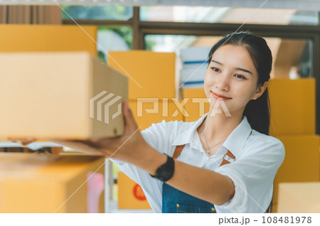 Small business owners online check stock on shelves, to calculate costs or check products for customers.concept shopping online Small business owners online check stock on shelves, to calculate costs or check products for customers.concept shopping online 108481978