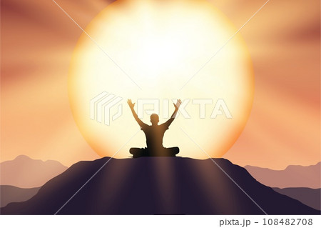 Silhouette of a person meditating on a mountain at sunrise 108482708