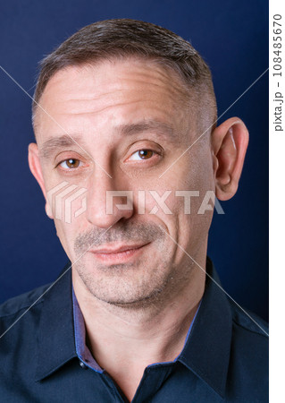 portrait of a man in a dark blue shirt 108485670